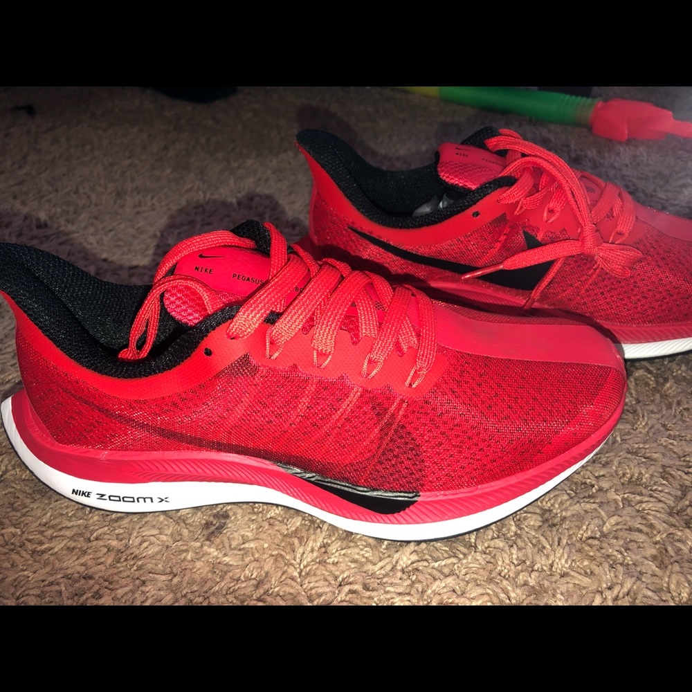 red and black Nike shoes